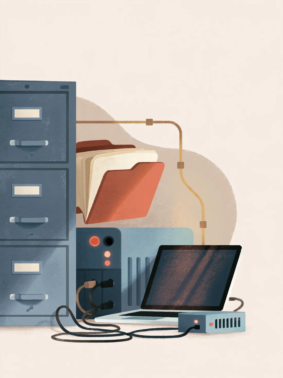 Filing cabinets and an older desktop computer connected by a gold cable to a modern laptop